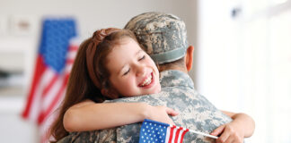 Happy Girl Daughter With American Flag Hugging Father Came Back From Us Army