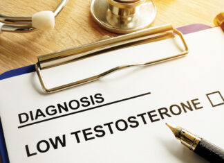 Diagnosis Low Testosterone And Pen On A Desk.