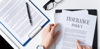 Business woman showing insurance document