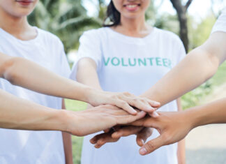Volunteers Standing Hands