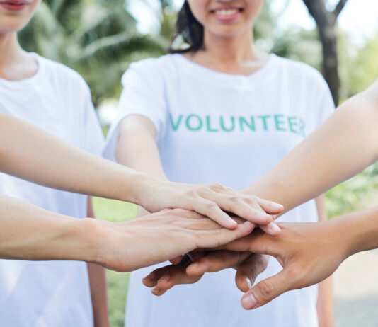 Volunteers Standing Hands