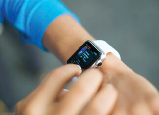 Person Checks Stats On The Screen Of Their Apple Watch. Original