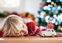 Child With Christmas Present. Kid With Xmas Gift.