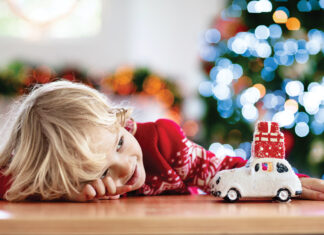 Child With Christmas Present. Kid With Xmas Gift.