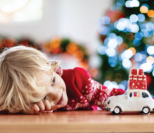 Child With Christmas Present. Kid With Xmas Gift.