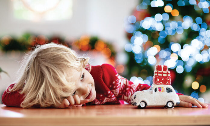 Child With Christmas Present. Kid With Xmas Gift.