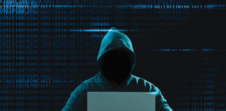 Big Financial Data Theft Concept. An Anonymous Hacker Is Hacking Highly Protected Financial Data Through Computers.