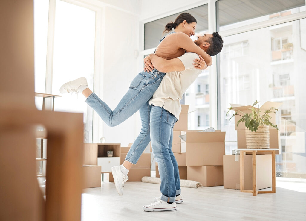 Young Couple Celebrating The Move Into Their New Home