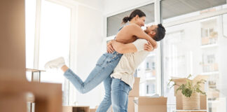 Young Couple Celebrating The Move Into Their New Home