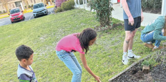 Opportunity Place kids planting flowers