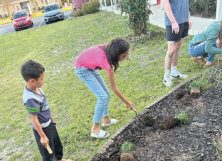 Opportunity Place kids planting flowers