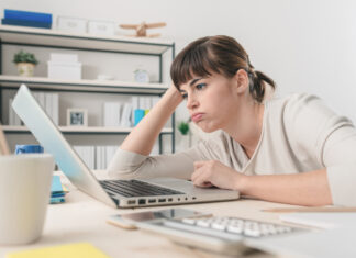 Disappointed Woman Working With A Laptop