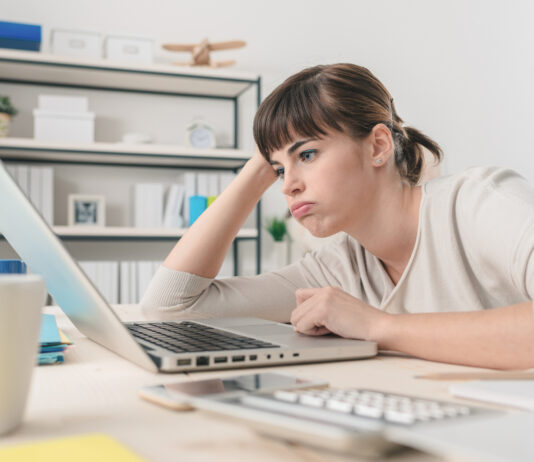 Disappointed Woman Working With A Laptop