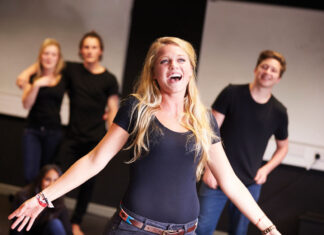 Students Taking Singing Class At Drama College