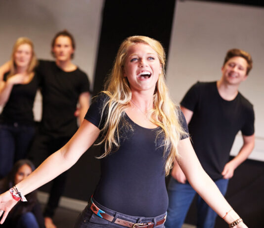Students Taking Singing Class At Drama College